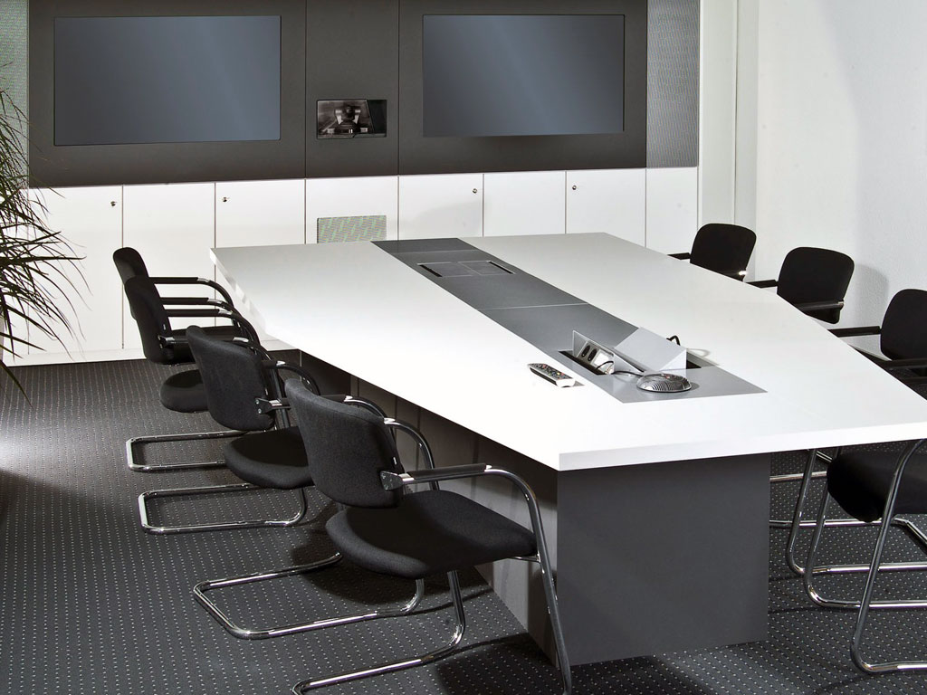 Conference table with integrated connection panels for media controls, playback devices, etc.