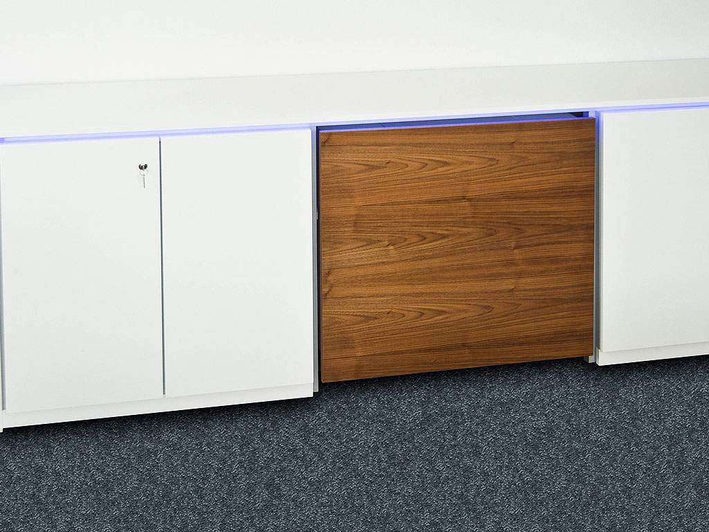 Media sideboard with integrated, height-adjustable beamer. Closed view.