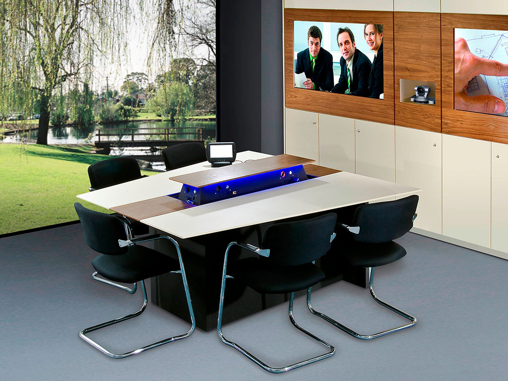 Media wall with two screens, video conferencing module and cabinets in a meeting room with conference table