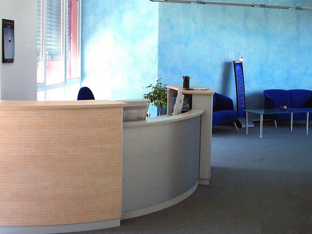 Rounded reception desk with PC
